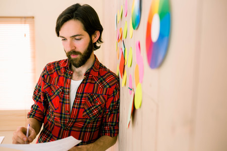 Creative businessman brainstorming ideas in casual officeの写真素材