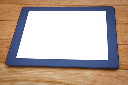 View of a blue tablet on wood plank
