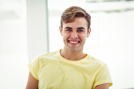 Smiling casual business man in casual officeの写真素材