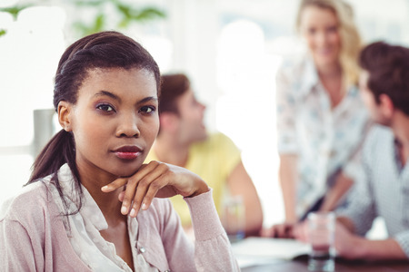 Creative business team working hard together in casual officeの写真素材
