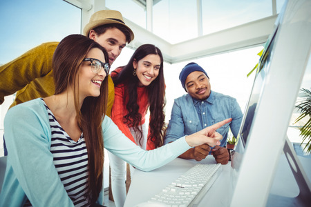Young creative team having a meeting in casual officeの写真素材