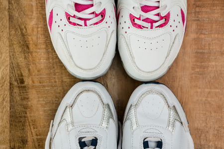 Running shoes on wooden table