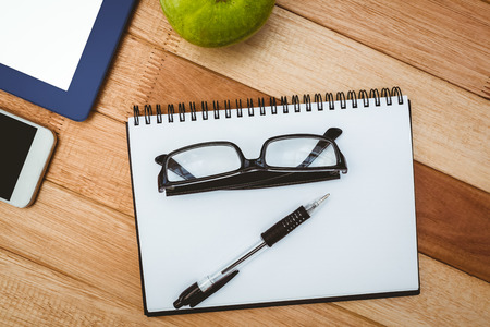 Above view of business stuff on wood deskの写真素材