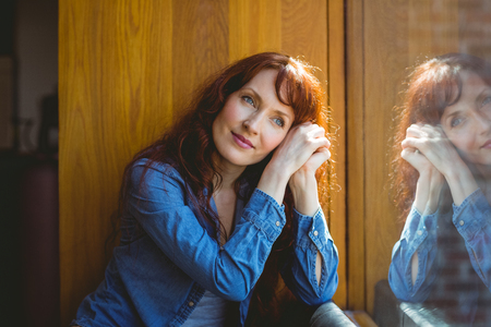 Mature student smiling in cafe at the universityの写真素材