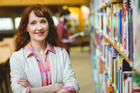 Mature student in the library at the universityの写真素材