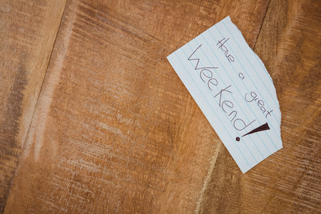 Close up view of a piece of paper on wood deskの写真素材