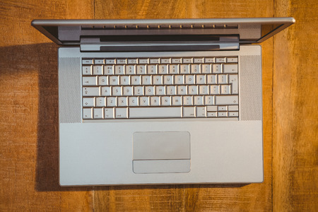 Above view of a laptop on wood deskの写真素材