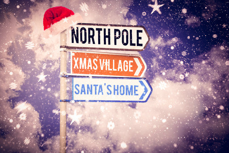 Santas address against blank sign posts against cloudy sky Digital image of blank sign posts against cloudy skyの写真素材