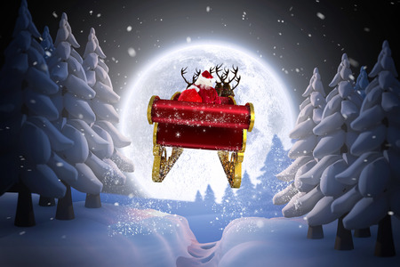 Santa flying his sleigh against winter snow sceneの写真素材
