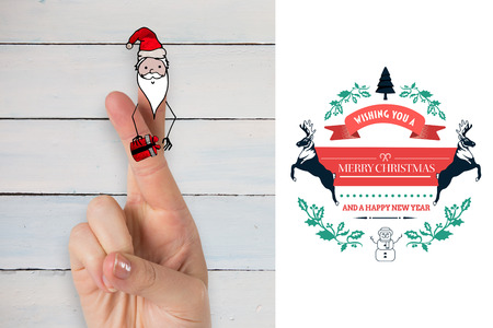 Christmas fingers against white background with vignetteの写真素材