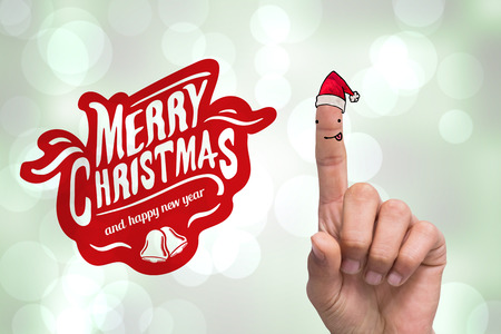 Hand pointing against grey abstract light spot designの写真素材