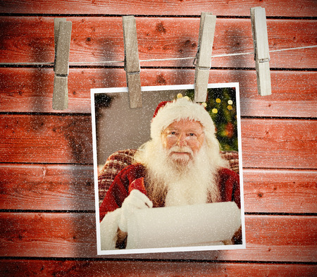 Christmas baubles against wooden backgroundの写真素材