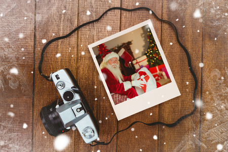 Instant photo against view of an old cameraの写真素材