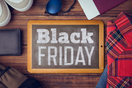 Black friday advert against hipsters deskの写真素材
