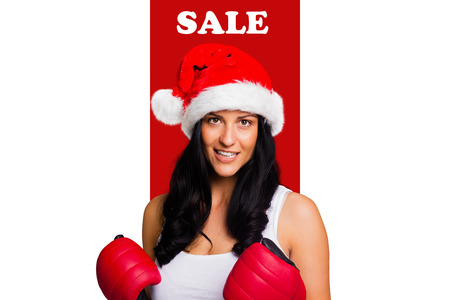 Woman wearing red boxing gloves against sale advertisementの写真素材