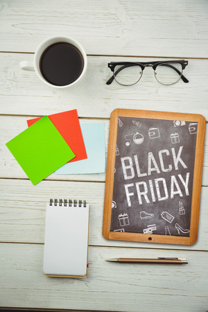 Black friday advert against hipsters deskの写真素材