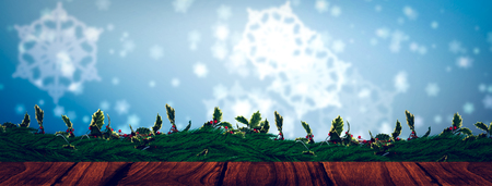 Wooden desk against digitally generated delicate snowflake designの写真素材