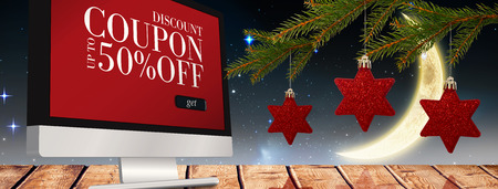 Star decorations on tree against sale advertisementの写真素材