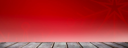 Digitally generated grey wooden planks against red snowflake background
