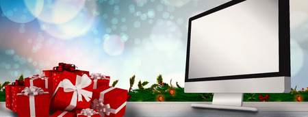 Red gifts with white bow against painted blue wooden planksの写真素材