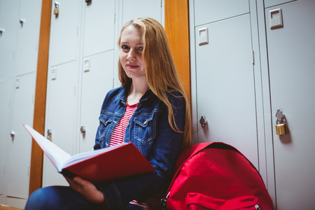 Focused student sitting and studying on notebook at the universityの写真素材