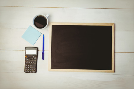 Overhead of desk with chalkboard and calculator shot in studio