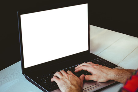 Man using his laptop at a deskの写真素材