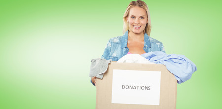 Portrait of cheerful woman volunteer  against green vignette