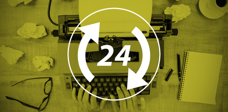 Twenty four and arrows against above view of old typewriter