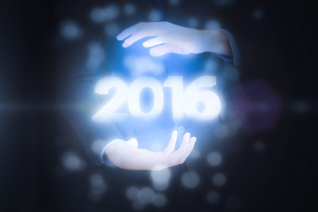 Mid section of a businessman presenting with his hands against 2016 graphicの写真素材