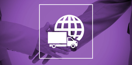 Close up of business people shaking their hands against logistics graphicの写真素材