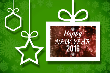 New year graphic against hanging christmas decorations on green