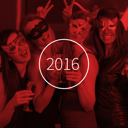Attractive women wearing masks holding champagne against new year graphicの写真素材