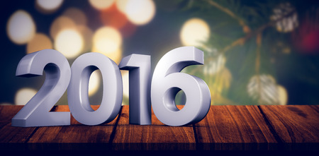 2016 graphic against fir tree branch with green needles