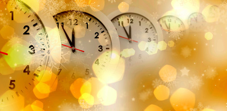 Clocks against yellow abstract light spot design