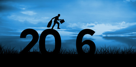 Businessman stepping against blue sky over grassの写真素材