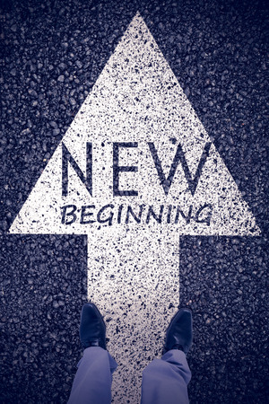 Low section of businessman against black roadの写真素材