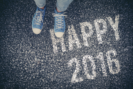 Casual shoes against black roadの写真素材