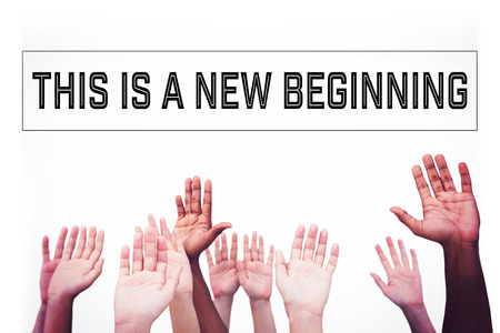 Hands raising in the air against motivational new years messageの写真素材