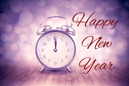 New years greeting against alarm clock