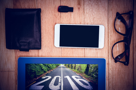 Close up view of geeks stuff against 2016 road