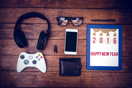 Happy New Year against close up view of geeks stuff