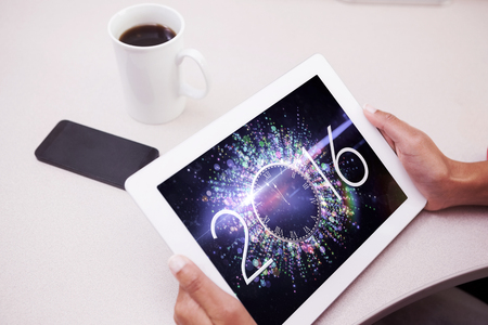 Woman using tablet pc  against new year countdown graphic