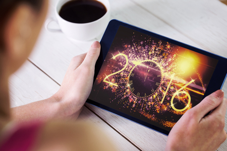 Woman using tablet pc against new year countdown graphic