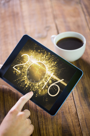 Woman using tablet pc against new year countdown graphic