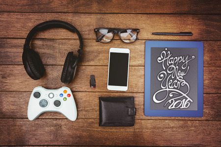 New year graphic against close up view of geeks stuff