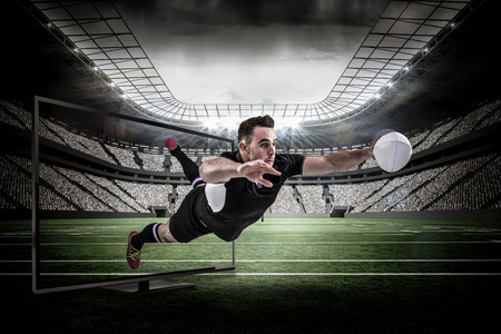 Rugby player scoring a try against rugby arenaの写真素材