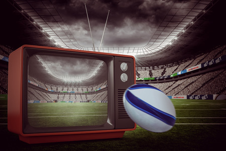 Rugby ball against rugby stadiumの写真素材
