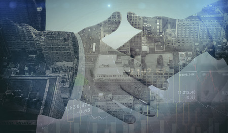 Stocks and shares against composite image of two people going to shake their handsの写真素材