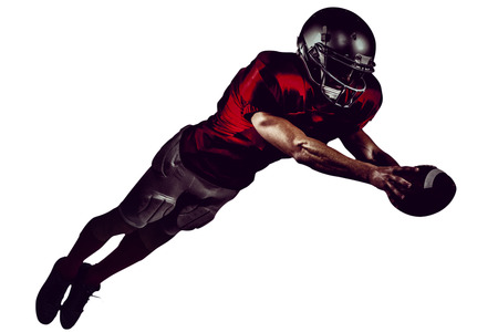 American football player scoring a touchdown on white backgroundの写真素材